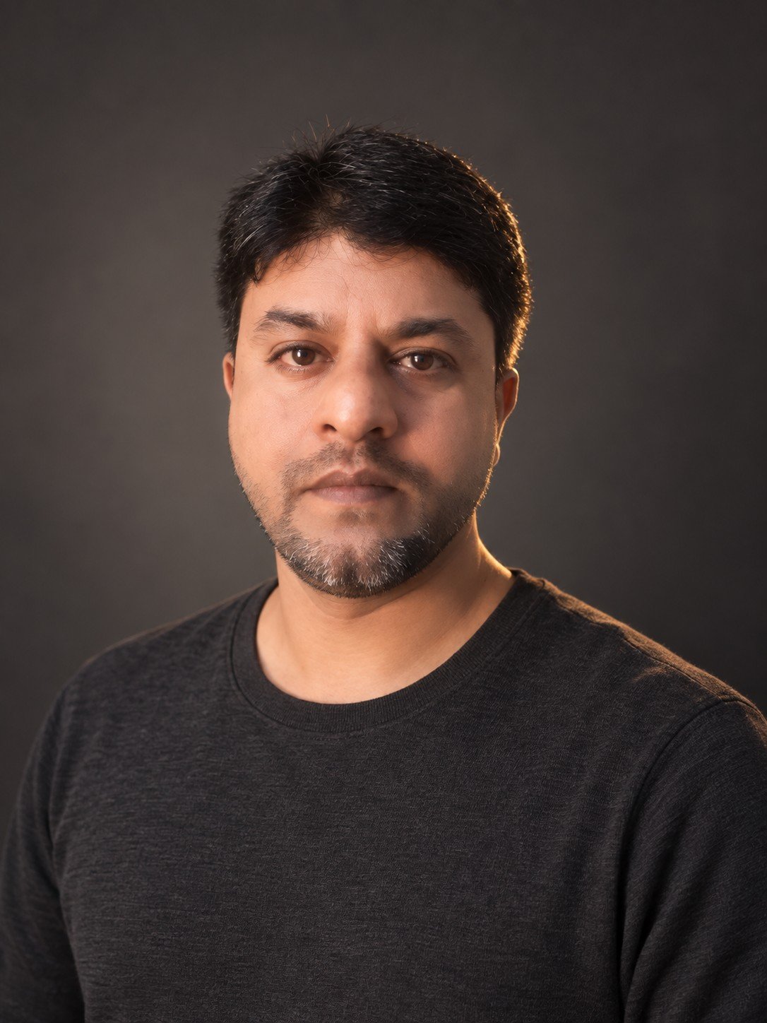 Studio-style portrait of Mubasheer Hussain